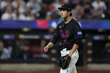 Jonah Tong Mets Marlins: Man in black uniform walks off baseball field