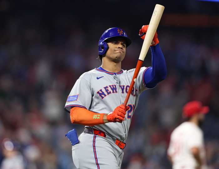 Juan Soto Mets: Baseball player in grey uniform smacks bat in frustration