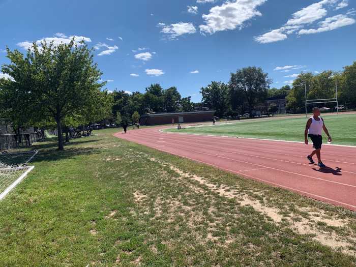 an athletic track at a park in Queens on a sunny day