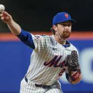 Team USA already recognizing Mets' Nolan McLean's high ceiling 8 Nolan McLean Mets Phillies: Man in white uniform and blue hat throws baseball