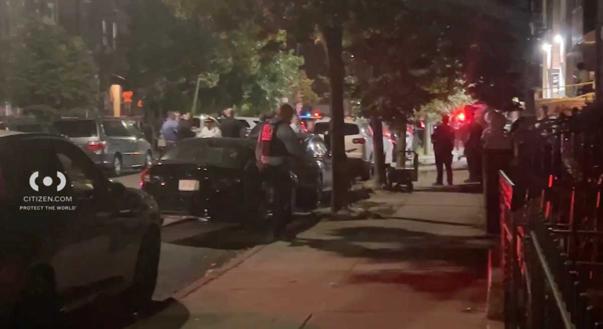 Police at Queens scene where woman was shot dead