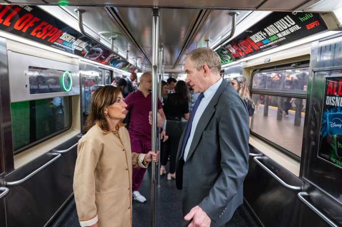 woman and man on subway train car speaking about subway crime