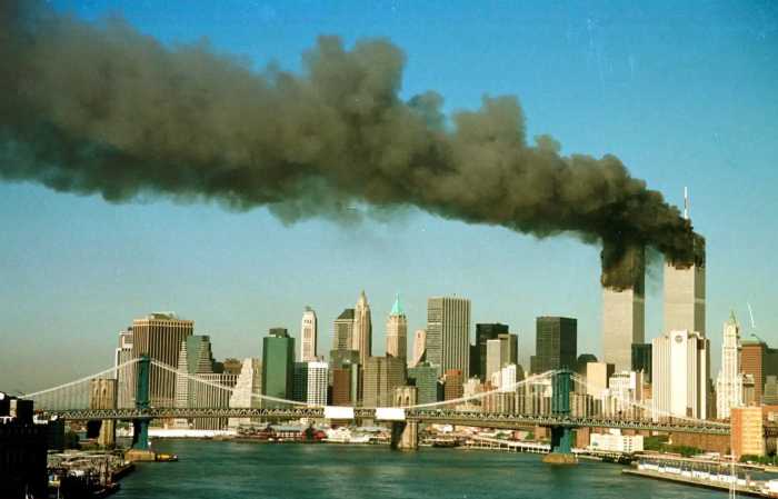 black smoke billows from World Trade Center twin towers on 9/11 during terrorist attacks