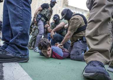 ICE agents tackle protester to the ground