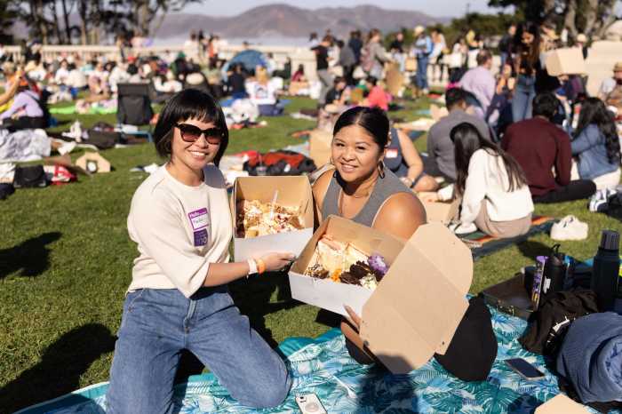 people with cakes at The Most Epic Cake Picnic Tour.