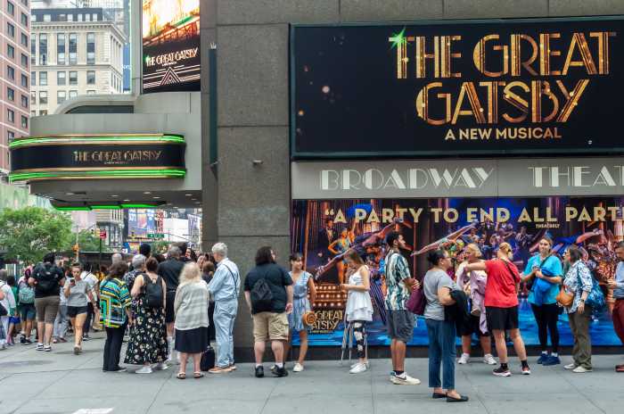 Broadway theater with visitors lined up in front