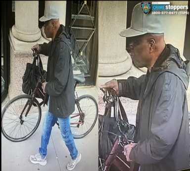 Woman robbed at gunpoint in uptown Manhattan subway station 24 man in white hat walking with a bike and holding bags