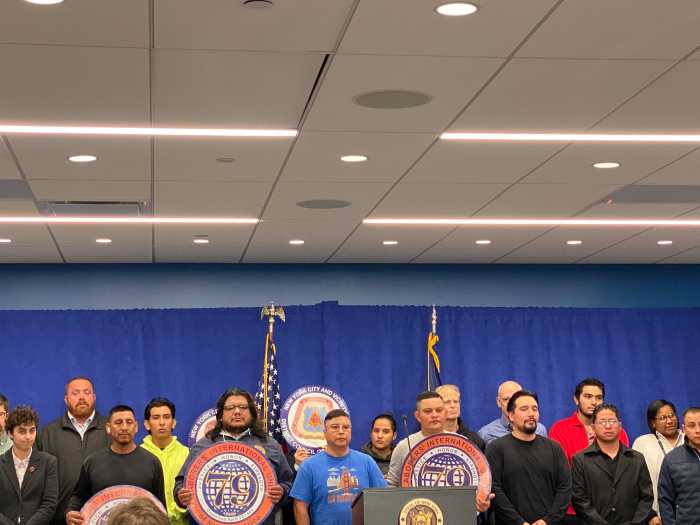 Workers and labor leaders stood alongside AG James at a press conference Tuesday