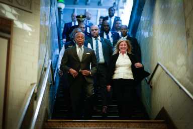 Mayor Eric Adams and Police Commissioner Jessica Tisch arrive at the 42nd Street–Times Square subway station on Friday, ahead of the heated news conference marking the one-year anniversary of the PATH outreach program.