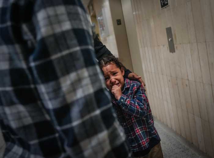 child in tears after ICE agents seize family member