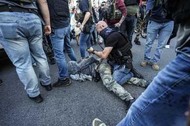 ICE arresting a protester during chinatown raid