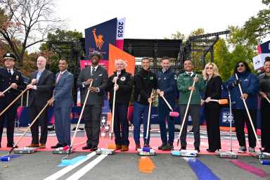 people painting finish line of NYC Marathon