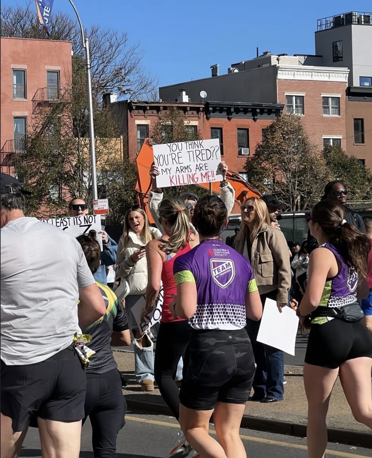 the sign reads: you think you're tired? my arms are killing me!