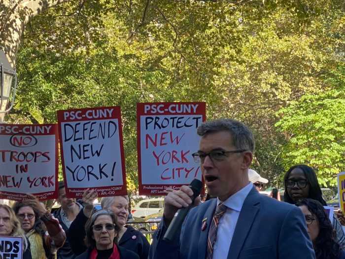 James Davis closes the 'Hands Off NYC' rally with a vow to stay organized and noncooperative, leading the crowd in a final chant of 'Hands off New York City