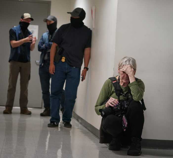 photojournalist in grief after witnessing ICE detention of immigrant