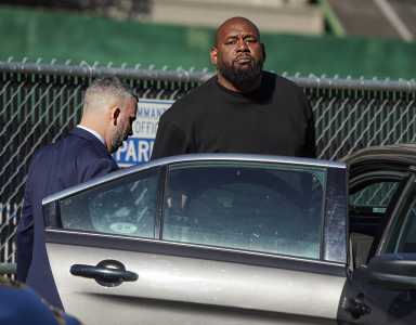 BLM New York founder Hawk Newsome surrenders on Harlem felony assault charges, calls arrest 'political attack' 3 BLM New York Co-founder Hawk Newsome looks at cameras following his arrest.