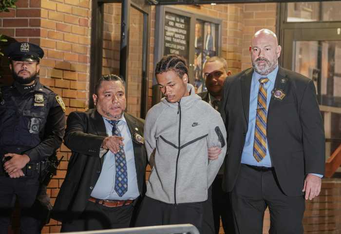 Teen surrenders to police in murder of autistic man at Bronx park 1 suspect in Bronx murder surrenders to police at perp walk