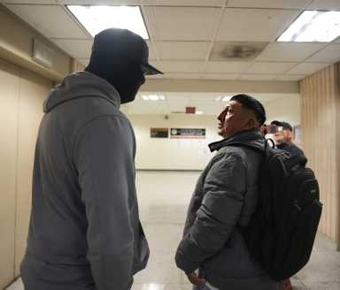 A man is approached by ICE at 26 Federal Plaza in Manhattan.