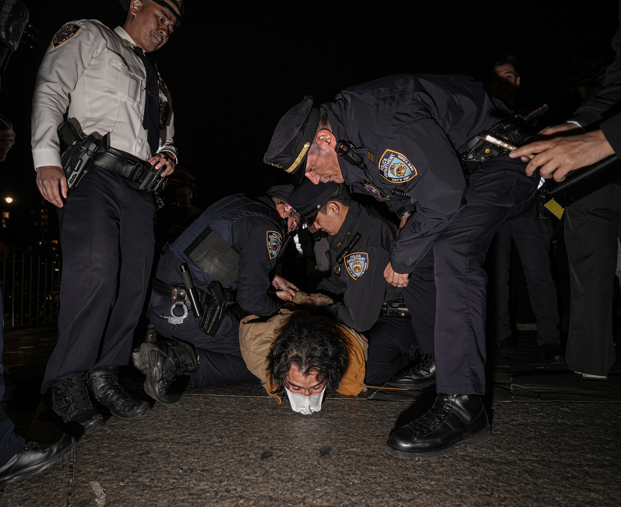 NYPD officers arrest a protester during a demonstration in Lower Manhattan on Wednesday night