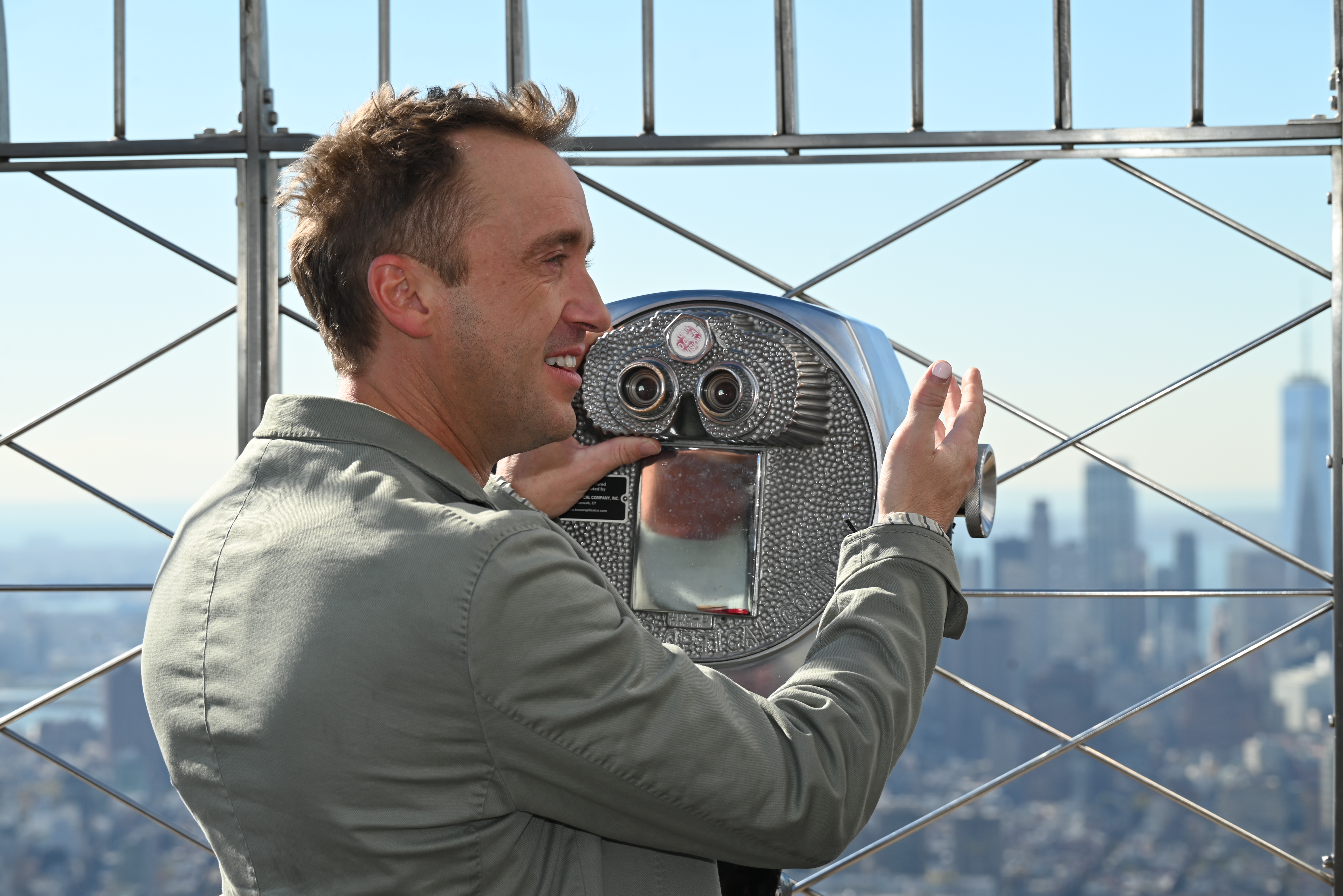 Tom Felton lights the Empire State Building in Slytherin green for Broadway debut 2 Tom Felton at the Empire State Building.