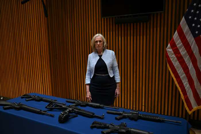 Brooklyn drug and gun ring broken up after undercover NYPD probe, officials announce 4 Special Narcotics Prosecutor Bridget Brennan stands beside a table of seized firearms, including handguns, rifles, and high-capacity magazines, displayed after the announcement of “Operation Get Sturdy”