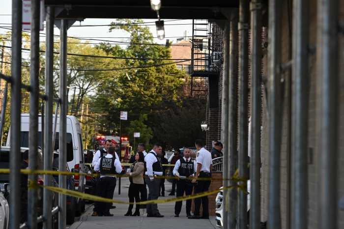 NYPD Officers and NYPD Fire Marshals are investigating the fire and stabbing at 45-18 Smart Street.