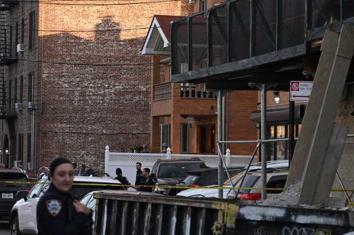 At the scene, the block was taped off with swarms of police around the residential home.