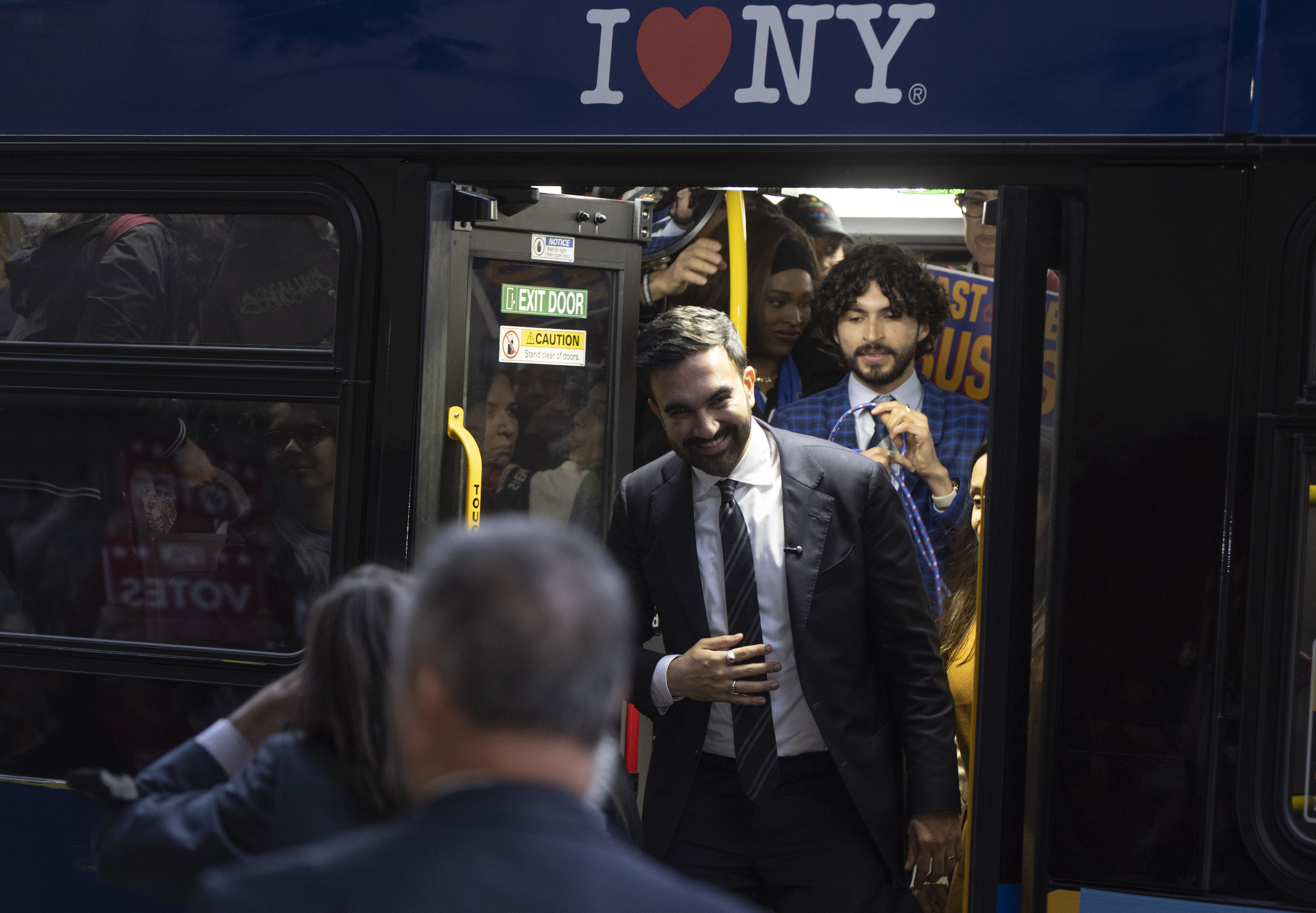 Democratic nominee and Queens assembly member Zohran Mamdani arrives to the debate on the bus.