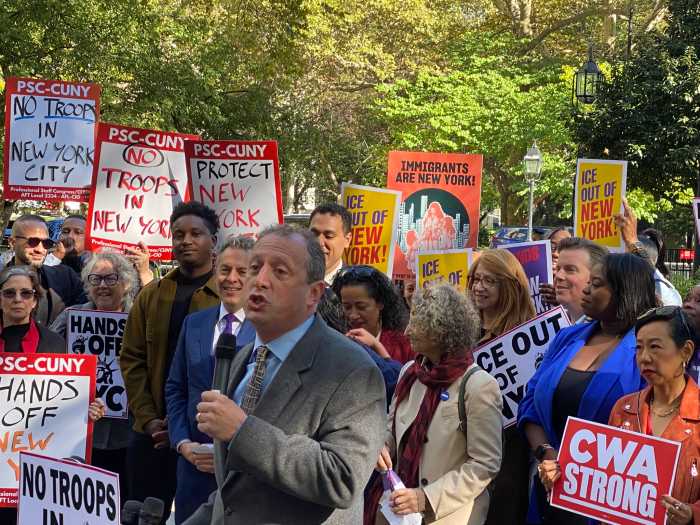 City Comptroller Brad Lander addresses the crowd at City Hall Park, framing the 'Hands Off NYC' campaign as part of New York's long legacy of resistance against federal overreach.
