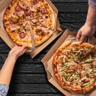 Things to do this weekend in NYC, Oct. 17-19 3 Overhead view of hands taking pizza from cardboard box