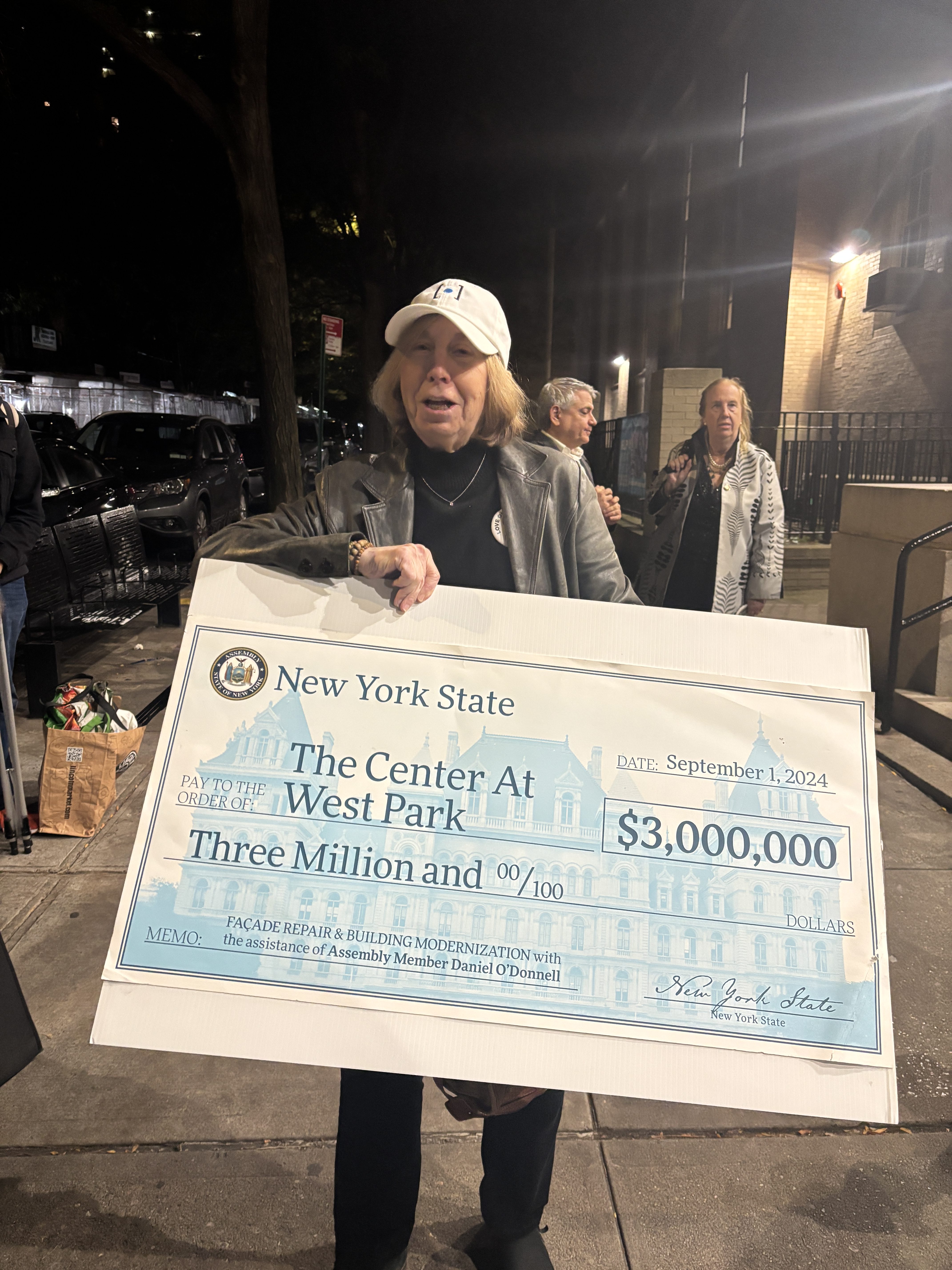 Hundreds oppose Upper West Side church demolition at community meeting 4 A few million reasons it might be possible, even affordable, to save the church building. Debby Hirshman holds a mock-up of a check from the state her group received that could be used to help with repairs.