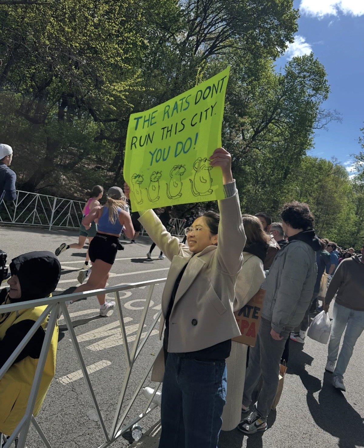 NYC MARATHON | The funniest NYC Marathon signs that could only exist here 3 the sign reads: rats don't run this city, you do!