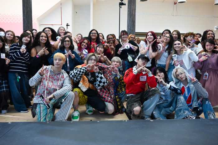 P1Harmony posed with their fans at hello82 NYC's flagship location in SoHo.