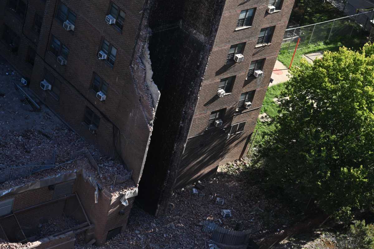 damaged building shaft with fallen brick at Bronx collapse site