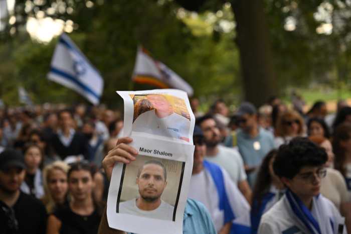 People marched through Central Park carrying photos of Israelis killed in the Oct. 7, 2023, attacks, including Maor Rafael Shalom, a 46-year-old retired Shin Bet officer