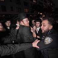 Cops wrestle with thousands of orthodox Jewish demonstrators protesting forced military conscription in Israel 39