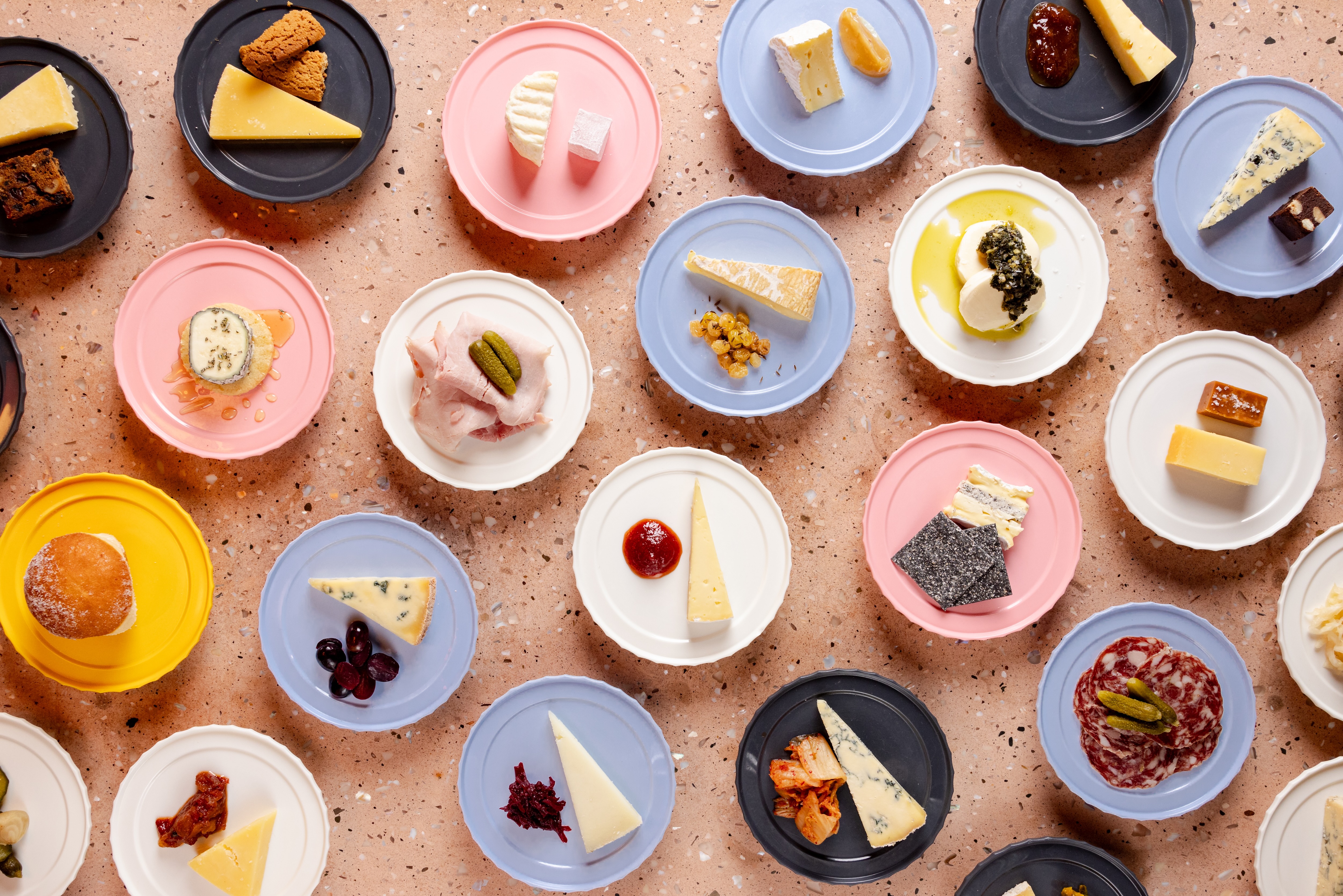 many plates of cheese like the ones you'll find at Pick & Cheese.