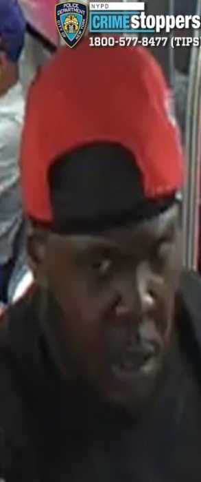 photo of man in a red hat