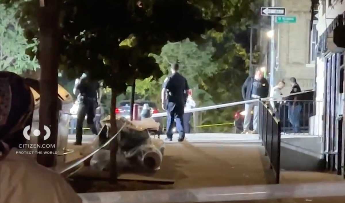 Police officers comb scene of Manhattan shooting for evidence