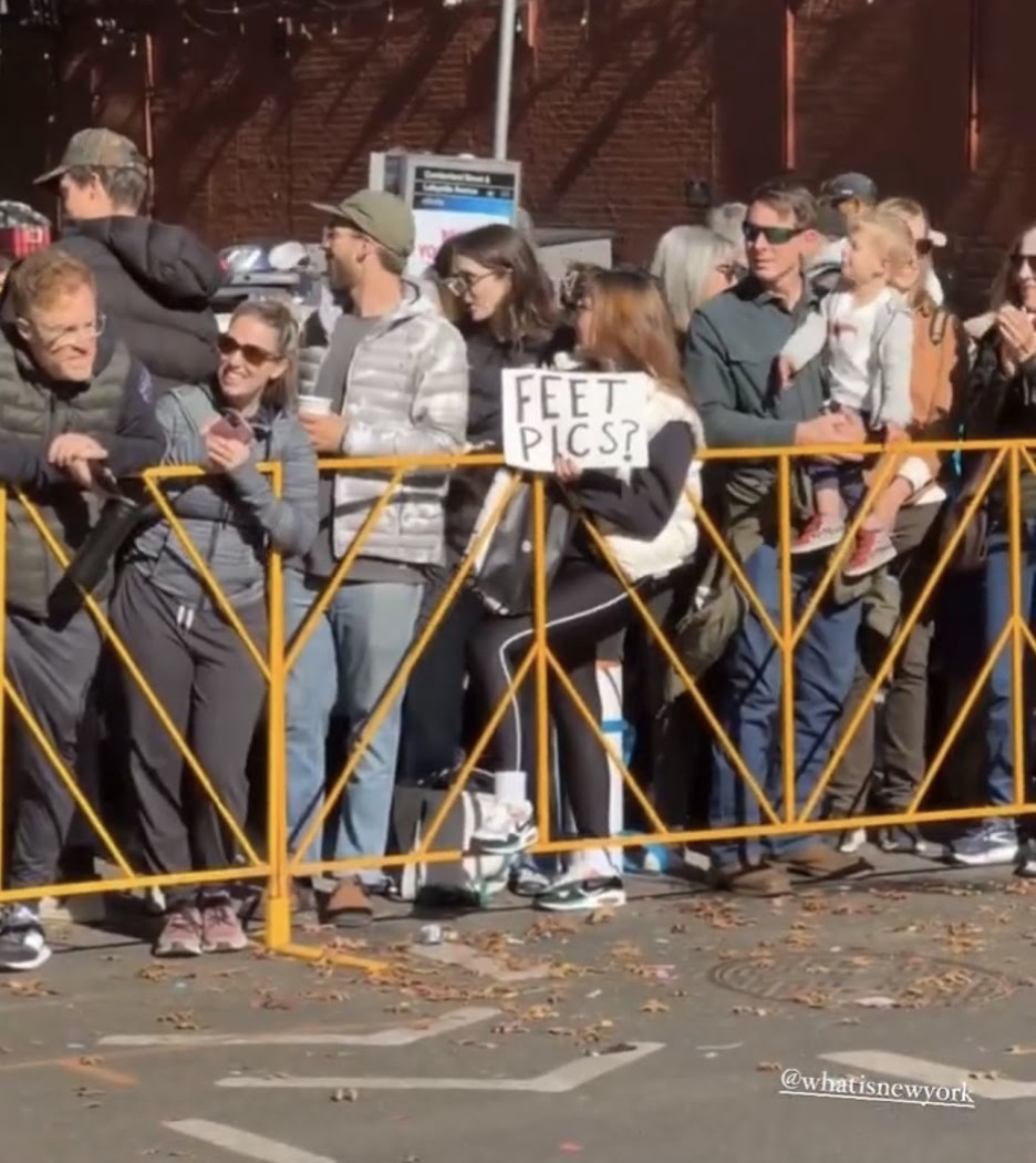 the sign reads: Feet pics?