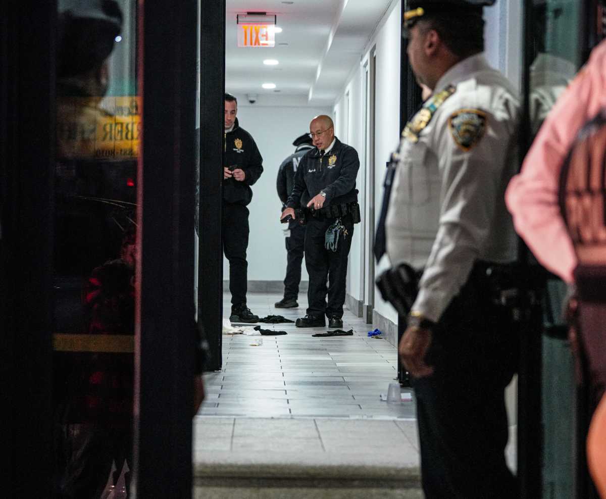 NYPD at scene in Bronx hallway where cop was shot