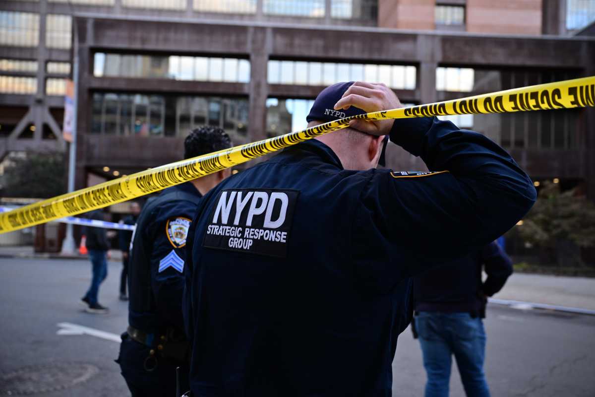 Brooklyn triple shooting near hospital leaves man and two teens wounded: cops 2 police officer at scene of Brooklyn shooting near hospital