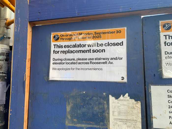 Rush-hour nightmare: Why the MTA is suspending express 7 trains for the next four weeks 2 white sign on a blue blockade