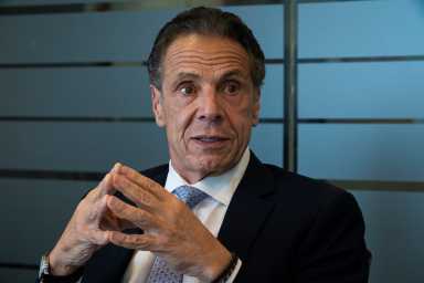 man wearing a suit and tie Andrew Cuomo