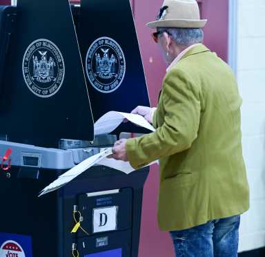 A person cast their vote during the first day of early voting in the general election in Brooklyn on Oct. 25, 2025.