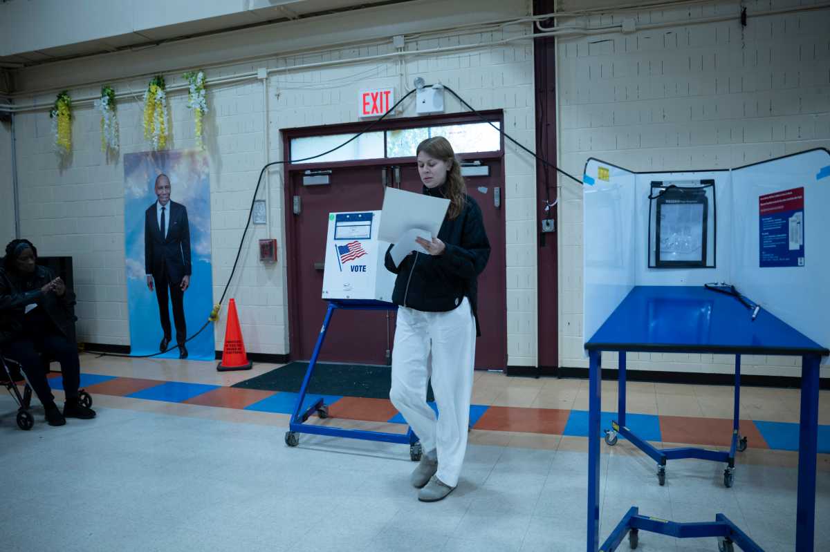 A woman casts her ballot during early voting in Brooklyn on Oct. 25, 2025.
