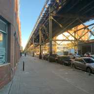 IBX Stop by Stop: East New York, Brownsville poised for more housing, shops and transit as plans for 14-mile light-rail continue 4 new building near train tracks