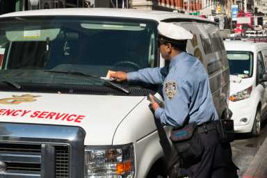 Op-ed | When it comes to fines, one size does not fit all 8 traffic agent issuing parking violation ticket that includes high fines