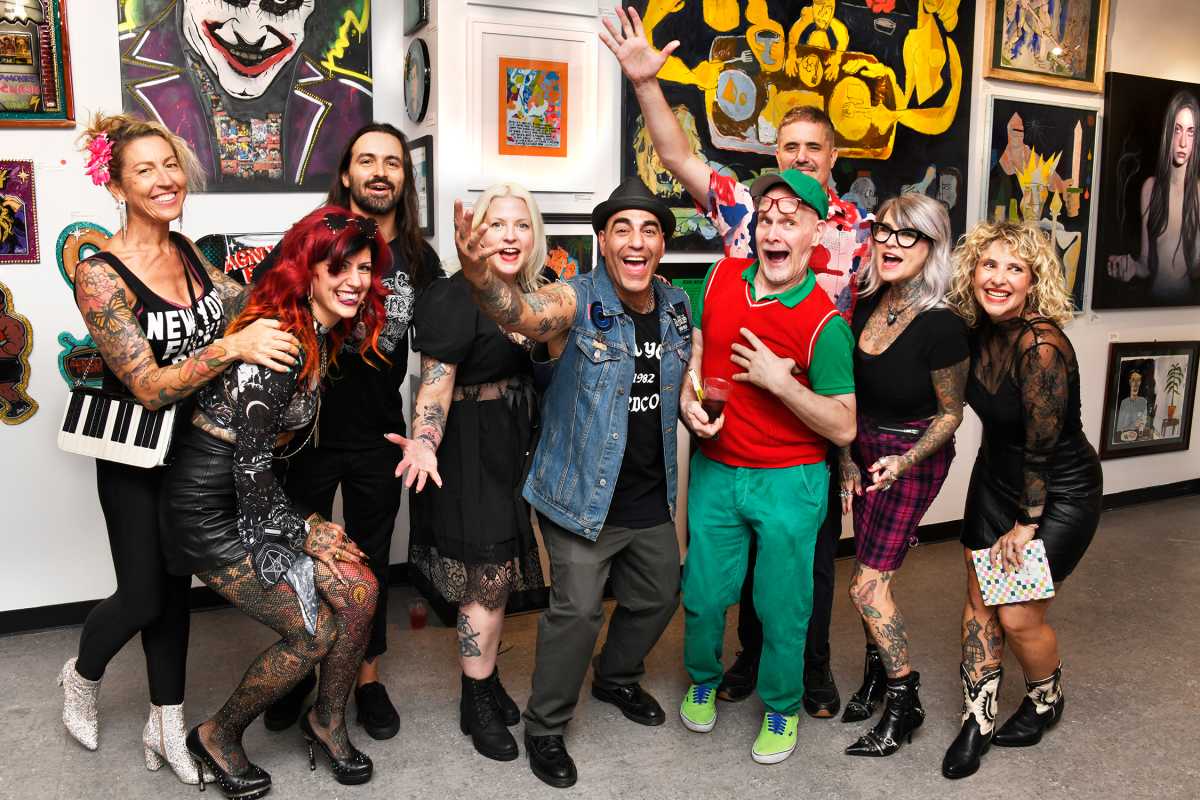 Punk rock performers gathered together at art show in Soho