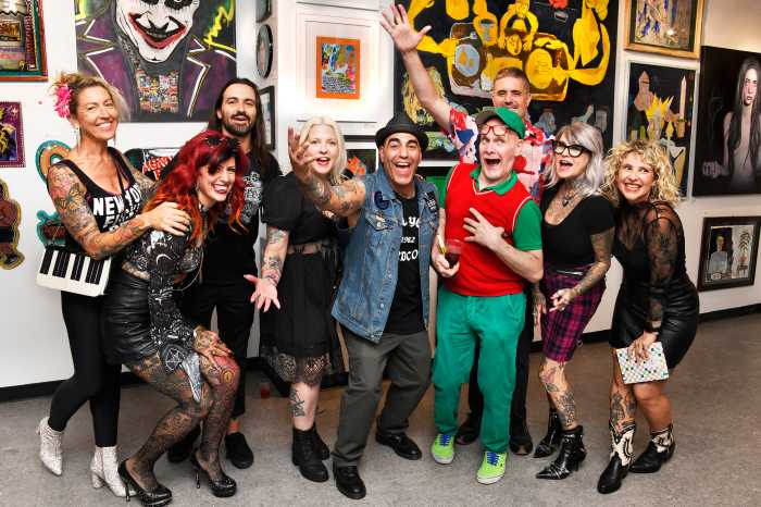 Punk rock performers gathered together at art show in Soho